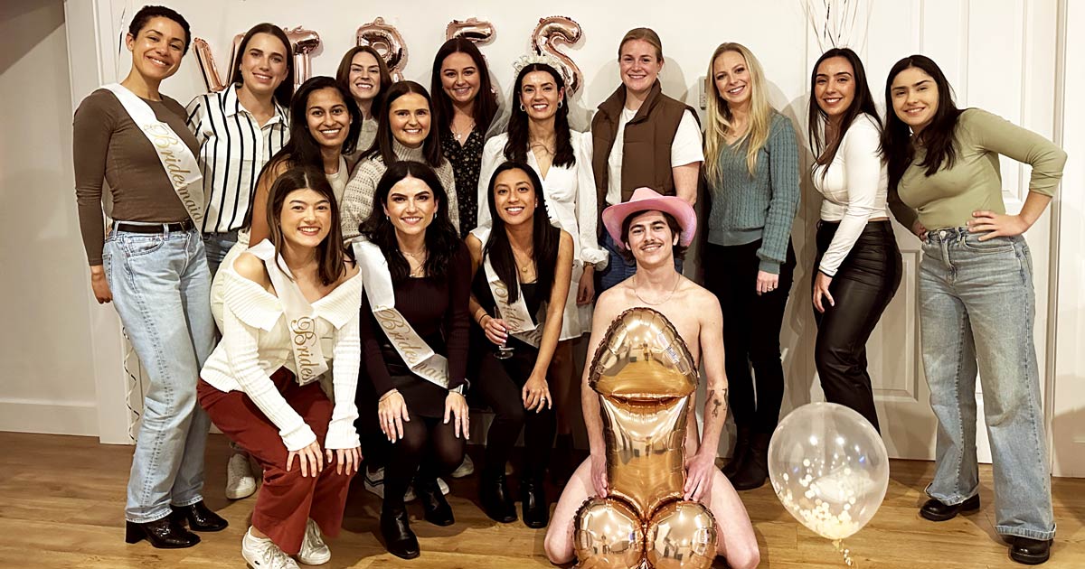 Sydney hens party life drawing class group laughing with male model